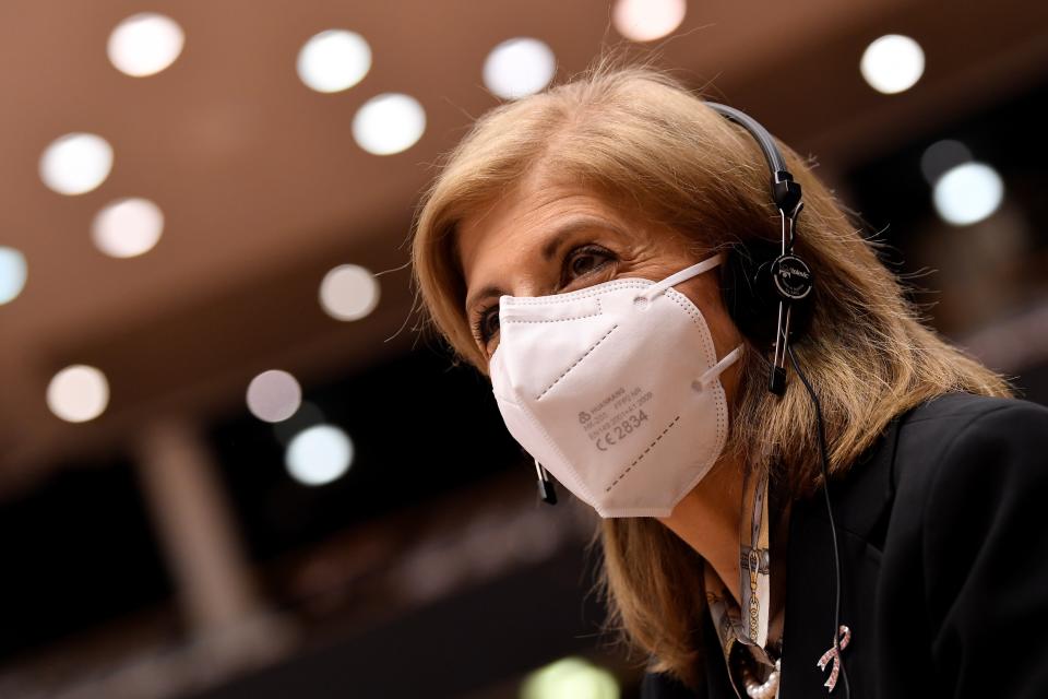 European Commissioner in charge of Health Stella Kyriakides arrives to he main chamber during a plenary session at the European Parliament in Brussels, Tuesday, Jan. 19, 2021. (John Thys, Pool Photo via AP)