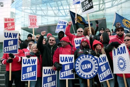 Striking United Auto Workers (UAW) members rally in front of General Motors World headquarters in Detroit