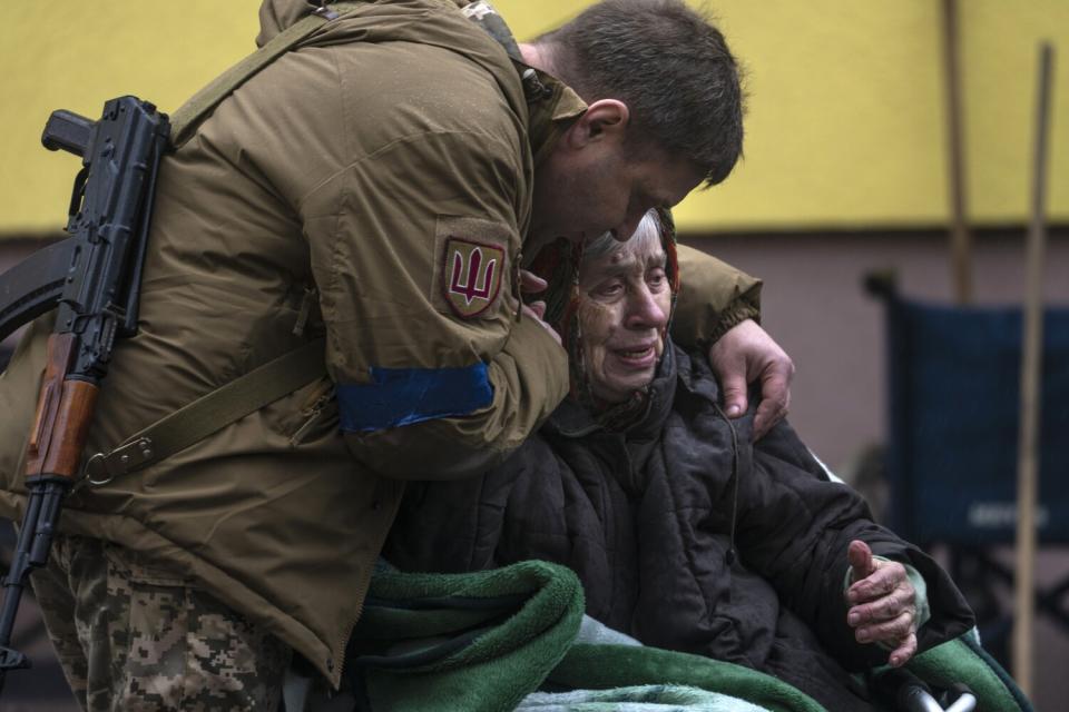 Soldier comforting an evacuee in Ukraine