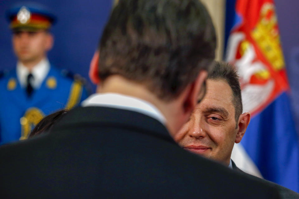 FILE - Serbian President Aleksandar Vucic, front, speaks with Serbian spy chief Aleksandar Vulin in Belgrade, Serbia, on April 23, 2018. Serbian pro-Russian head of the state's intelligence service, who has been under U.S. sanctions, resigned Friday, Nov. 3, 2023, citing his attempt to avoid possible further embargo against the Balkan nation. In July, the U.S. imposed sanctions on Aleksandar Vulin, accusing him of involvement in illegal arms shipments, drug trafficking and misuse of public office. (AP Photo/Darko Vojinovic, File)