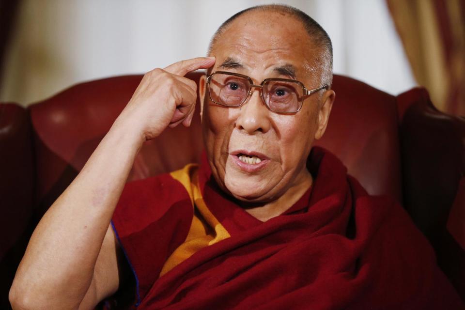 Tibetan spiritual leader the Dalai Lama makes a statement to reporters as he meets with House Speaker John Boehner of Ohio and House Minority Leader Nancy Pelosi of Calif., on Capitol Hill in Washington, Thursday, March 6, 2014. (AP Photo/Charles Dharapak)