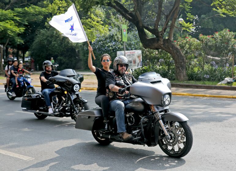 Guatemala vice presidential candidate Maximo Santa Cruz rides the streets of the country's capital.