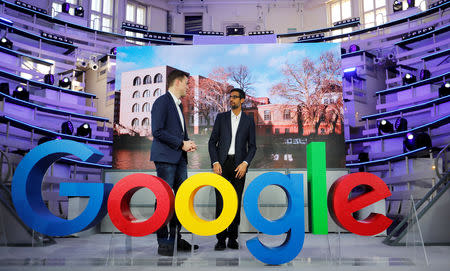 FILE PHOTO: Google CEO Sundar Pichai and Philipp Justus, Google Vice President for Central Europe and the German-speaking Countries, stand by a Google logo during the opening of the new Alphabet's Google Berlin office in Berlin, Germany, January 22, 2019. REUTERS/Hannibal Hanschke /File Photo
