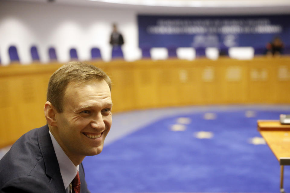 Russian opposition leader Alexei Navalny smiles before his hearing at the European Court of Human Rights in Strasbourg, eastern France, Thursday, Nov.15, 2018. Russia is awaiting the European court ruling on whether it violated the rights of Navalny when arresting him on repeated occasions. (AP Photo/Jean-Francois Badias)