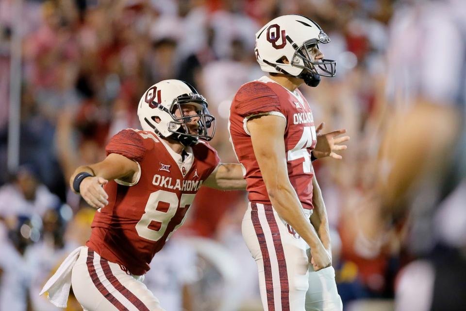 Gabe Brkic (47) celebrates his his game-winning field goal against West Virginia on Sept. 25 in Norman.