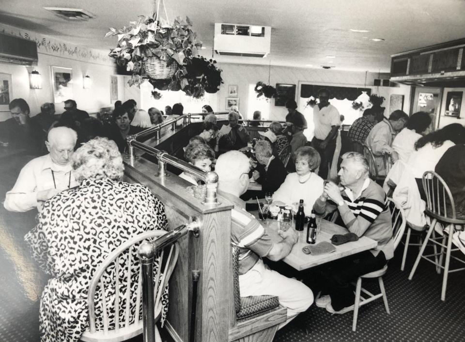 Diners enjoy their meals and each other's company in this dated picture, believed to be taken in the 1980s, at Alisson's Restaurant in Dock Square in Kennebunkport, Maine. The restaurant is celebrating its fiftieth anniversary in 2023.