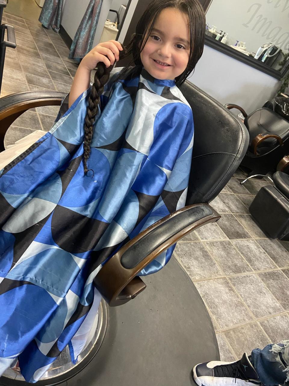 Ayla Robles, 5, is following in her family's 24-year-old tradition of donating hair to the Locks of Love Foundation, on Aug. 11, 2023.