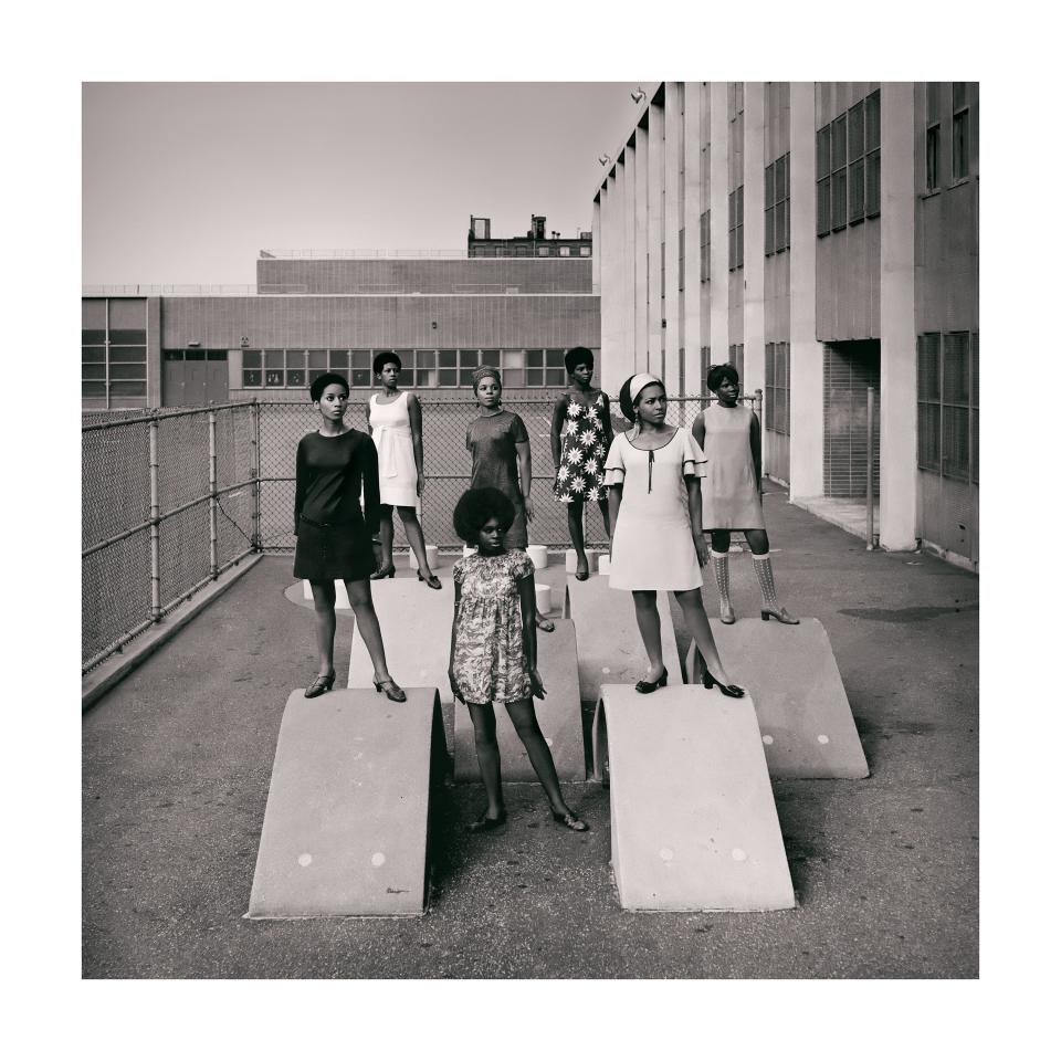 A photo shoot at a school for one of the many modeling groups that had begun to embrace natural hairstyles in the 1960s.