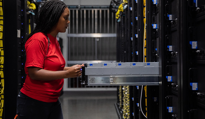 A Dropbox employee installs new storage technology in one of the company's data centers.