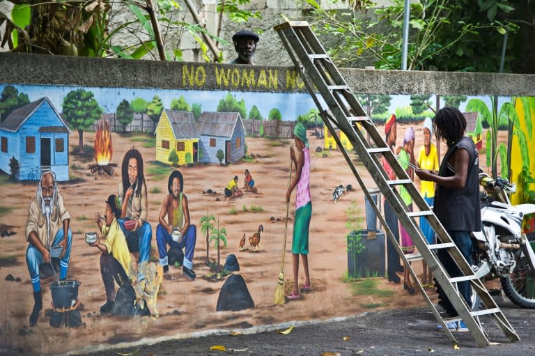 Museum staff working on a mural of Jamaican reggae legend Bob Marley at his museum in Kingston: reggae was added to UNESCO's list of world cultural treasures on November 29 2018