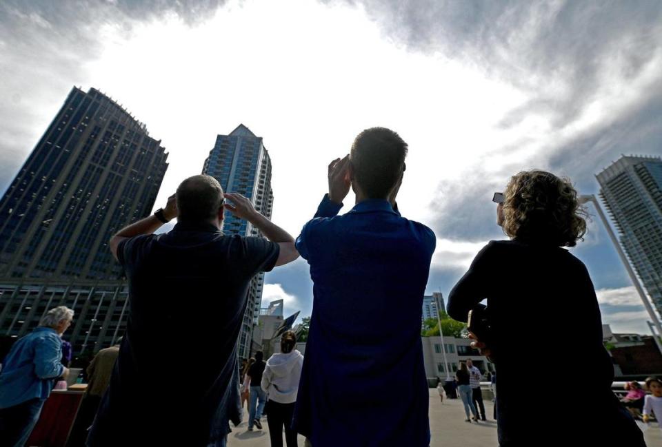 Spectators watch the solar eclipse during a viewing party in Charlotte.