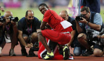 Trinidad and Tobago's Keshorn Walcott smiles to the photographers after winning gold in the men's javelin throw final at the London 2012 Olympic Games at the Olympic Stadium August 11, 2012. REUTERS/Stefan Wermuth (BRITAIN - Tags: OLYMPICS SPORT ATHLETICS MEDIA) 