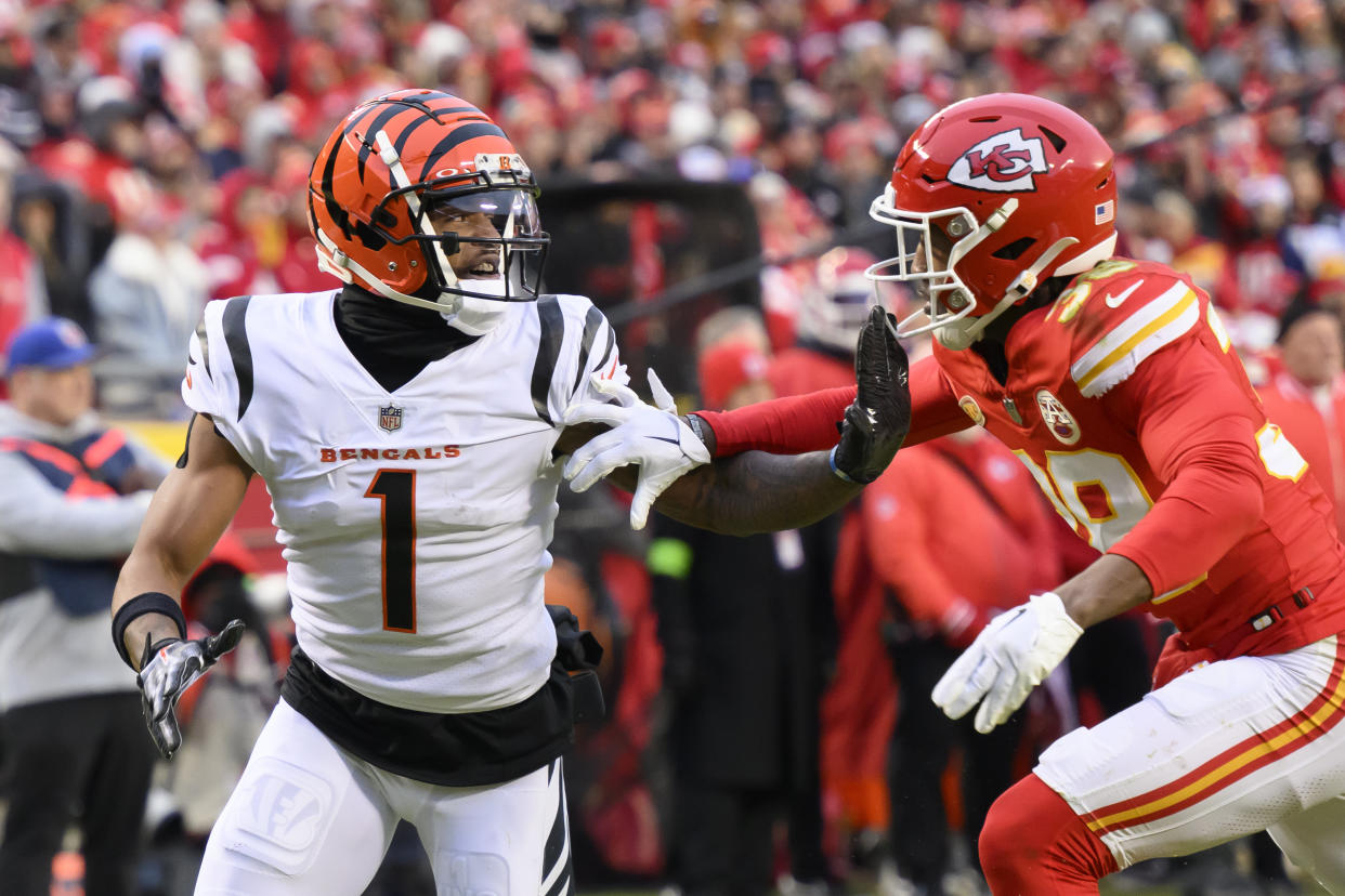 Cincinnati Bengals wide receiver Ja'Marr Chase (1) battles with Kansas City Chiefs cornerback L'Jarius Sneed (38) during the first half of an NFL football game, Sunday, Dec. 31, 2023 in Kansas City, Mo. (AP Photo/Reed Hoffmann)