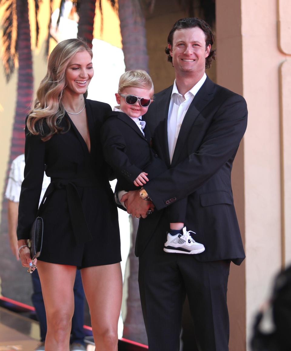 New York Yankees pitcher Gerrit Cole in a black suit arrives with his family at the 2022 MLB All-Star Game Red Carpet Show.