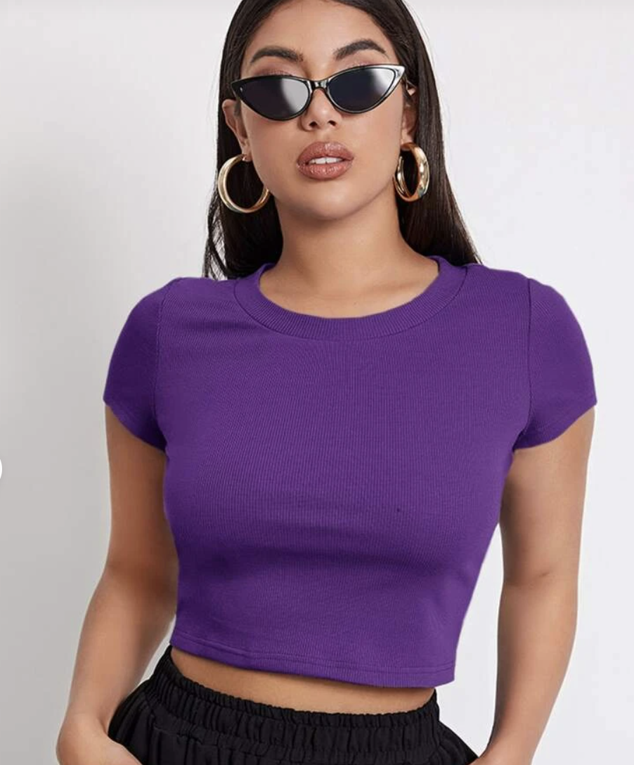 Model wears bright purple Rib knit crop top, $6.95, from Shein with black cat's eye sunglasses and gold hoop earrings.