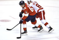 Florida Panthers defenseman Markus Nutivaara (65) brings the puck up the ice as Detroit Red Wings center Frans Nielsen (81) defends on the play during the first period of an NHL hockey game Tuesday, Feb. 9, 2021, in Sunrise, Fla. (AP Photo/Jim Rassol)