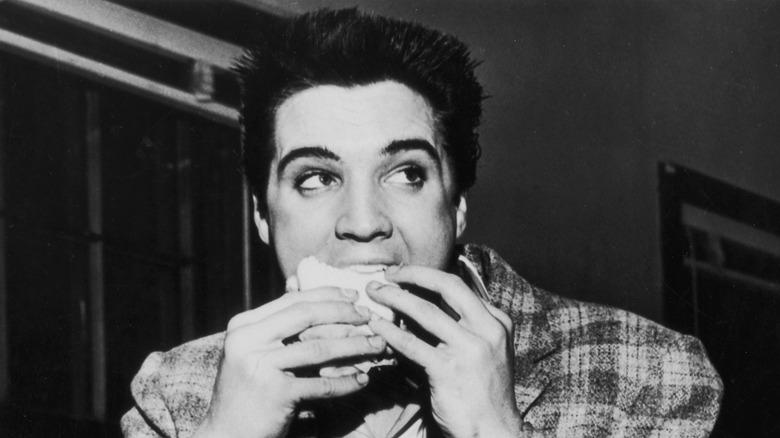 Elvis eating a sandwich