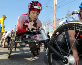 Wakako Tsuchida, center, from Japan, waits for the start of the wheelchair division of the 116th running of the Boston Marathon, in Hopkinton, Mass., Monday, April 16, 2012. (AP Photo/Stew Milne)