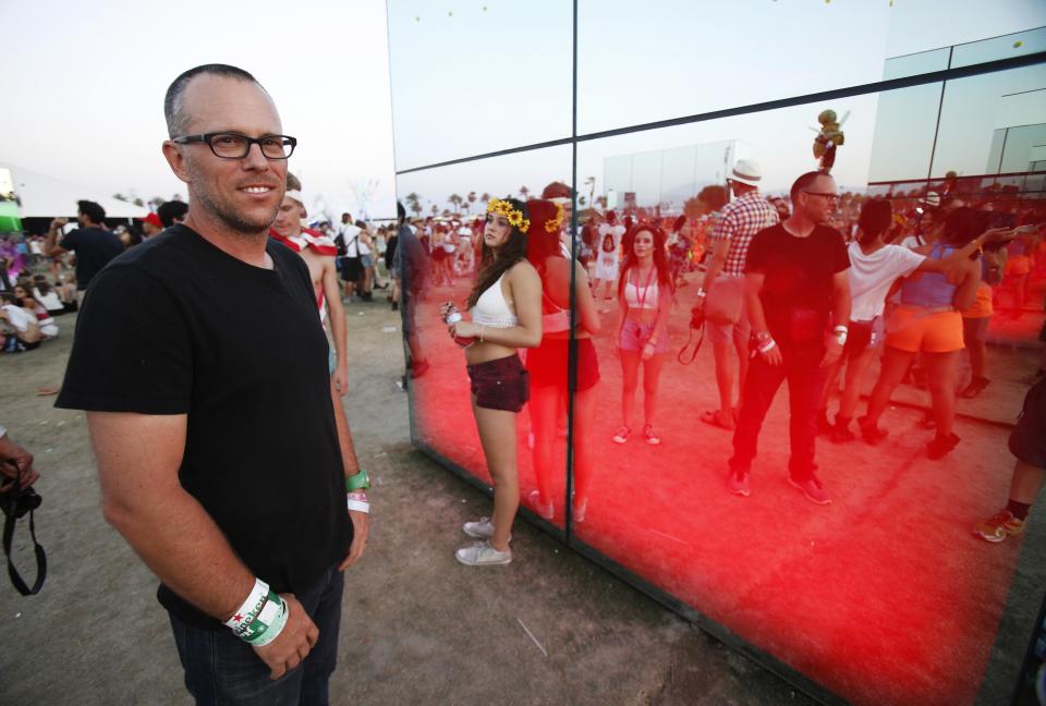 Artist Phillip K. Smith III poses by his light installation called "Reflection Field" at the Coachella Valley Music and Arts Festival in Indio, California April 13, 2014. REUTERS/Mario Anzuoni (UNITED STATES - Tags: ENTERTAINMENT)