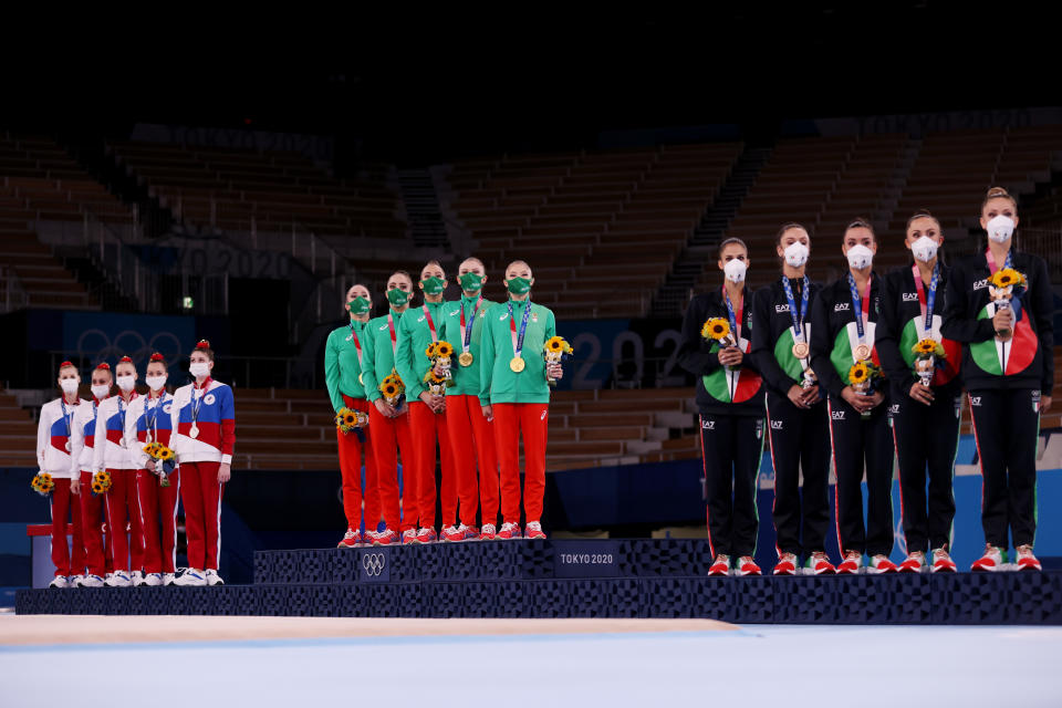 <p>Silver medalists Team ROC, gold medalists Team Bulgaria and bronze medalists Team Italy pose on the podium after the Group All-Around Final at Ariake Gymnastics Centre on August 08, 2021 in Tokyo, Japan. (Photo by Jamie Squire/Getty Images)</p> 