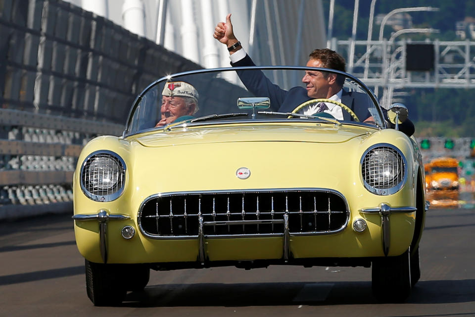 Andrew Cuomo drives a 1955 Chevrolet Corvette with World War II veteran Armando "Chick" Gallela, during a dedication ceremony for the new Governor Mario M. Cuomo Bridge. The structure will replace the current Tappan Zee Bridge over the Hudson River in Tarrytown, New York. (Photo: Mike Segar / Reuters)