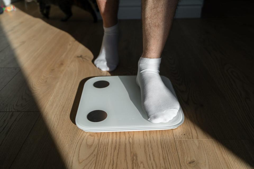 Some people regain weight after stopping incretin-based drugs. <a href="https://www.gettyimages.com/detail/photo/mid-adult-man-step-on-weight-scales-at-home-royalty-free-image/1468770376?adppopup=true" rel="nofollow noopener" target="_blank" data-ylk="slk:Oleksandra Troian/Moment via Getty Images;elm:context_link;itc:0;sec:content-canvas" class="link ">Oleksandra Troian/Moment via Getty Images</a>