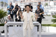 Lee Jung-jae poses for photographers at the photo call for the film 'Hunt' at the 75th international film festival, Cannes, southern France, Thursday, May 19, 2022. (Photo by Joel C Ryan/Invision/AP)