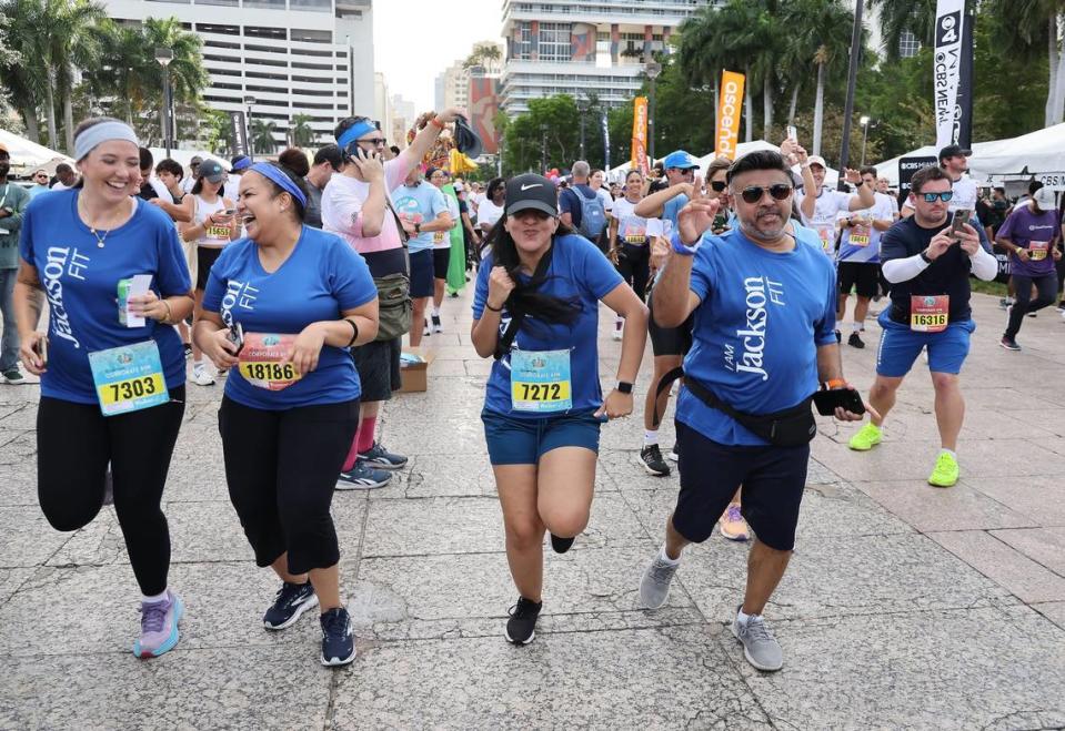 Runners warm up in Bayfront Park before the start of the race in Downtown Miami.