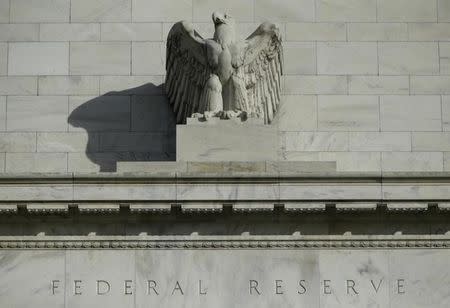 A detail from the front of the United States Federal Reserve Board building is shown in Washington October 28, 2014. REUTERS/Gary Cameron/Files