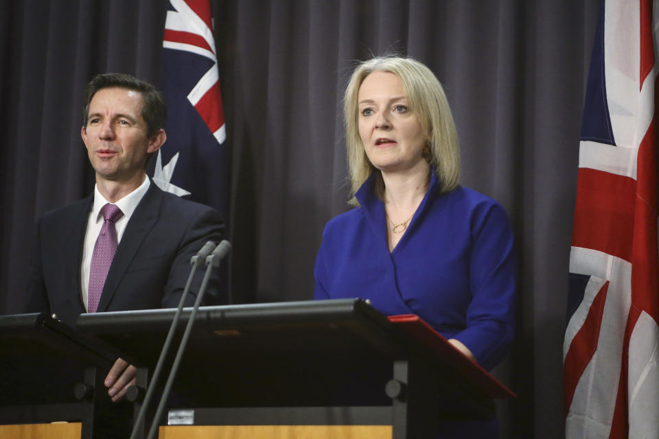 Australian Trade Minister Simon Birmingham, left, and British International Trade Secretary Liz Truss hold a press conference in Parliament House in Canberra, Australia, Wednesday, Sept. 18, 2019. Truss says she expects Britain will to strike a free trade deal with Australia within months of leaving the European Union. (AP Photos/Rod McGuirk)