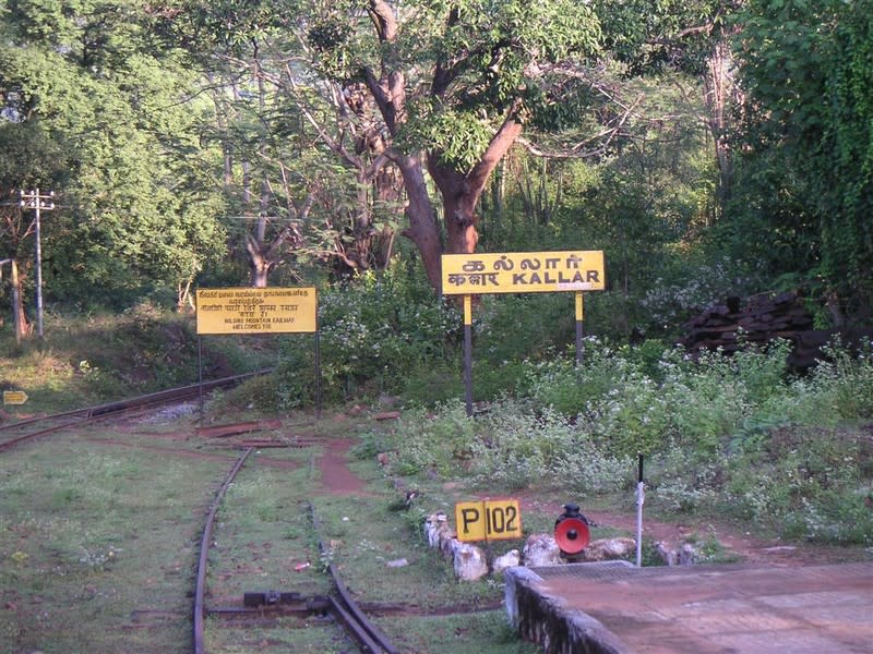 At Kallar, a board welcomes passengers to the dense forest at the beginning of the NMR. It is here that the rack-and-pinion system begins.