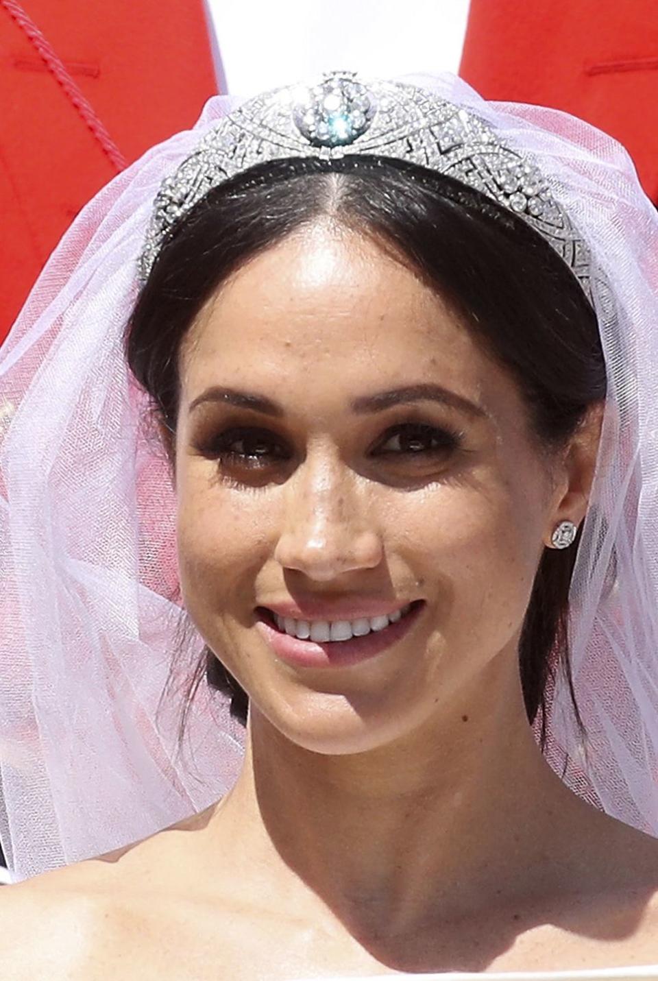 <p>The showstopping bandeau tiara worn by Meghan, Duchess of Sussex, on her wedding day was made by Garrard in 1925 for the Queen's grandmother, Queen Mary. It originally had a sapphire centerpiece, but it has since been changed to a diamond. It was loaned to Meghan by the Queen for her wedding day. The tiara was also worn by the late Princes Margaret, the Queen's sister.</p>