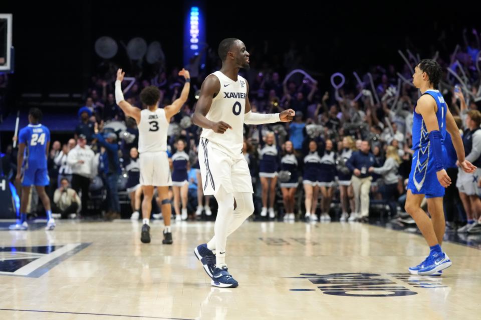 Souley Boum (0) and the Xavier basketball team host Marquette in an intriguing men's college basketball game on Sunday.