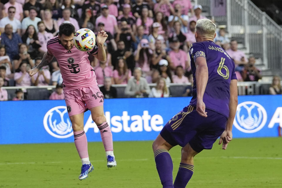 Inter Miami forward Lionel Messi (10) heads the ball past Orlando City defender Robin Jansson (6) to score his side's fifth goal during the second half of an MLS soccer match, Saturday, March 2, 2024, in Fort Lauderdale, Fla. (AP Photo/Rebecca Blackwell)