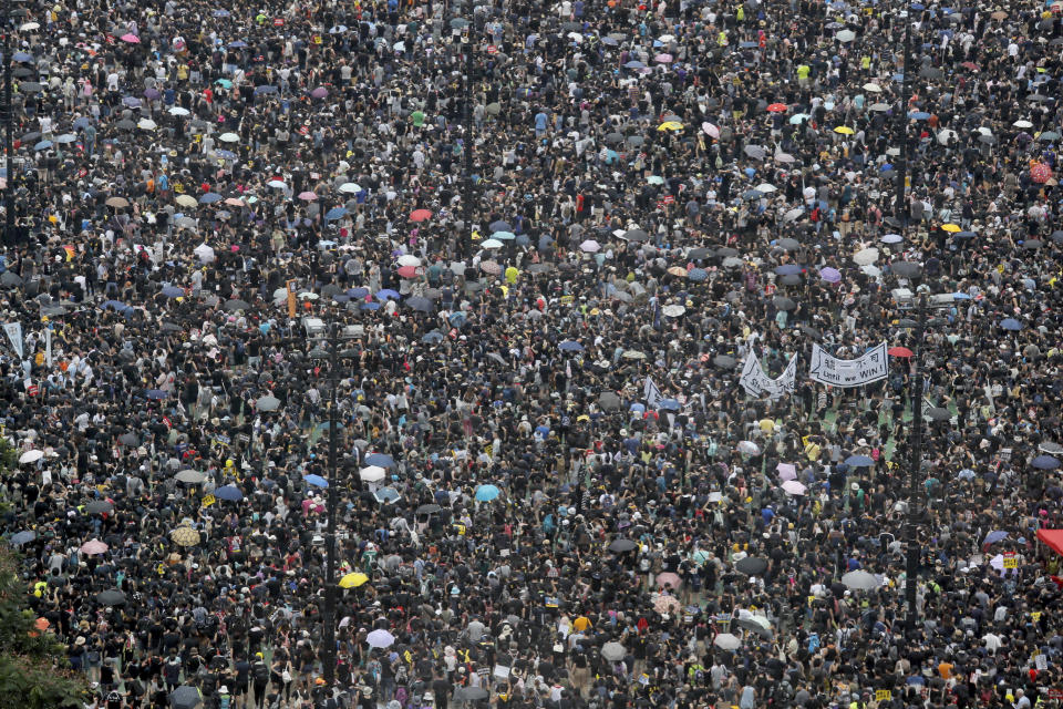 Protesters gather on Victoria Park in Hong Kong on Sunday, Aug. 18, 2019. Thousands of people streamed into a park in central Hong Kong on Sunday for what organizers hope will be a peaceful demonstration for democracy in the semi-autonomous Chinese territory. (AP Photo/Kin Cheung)