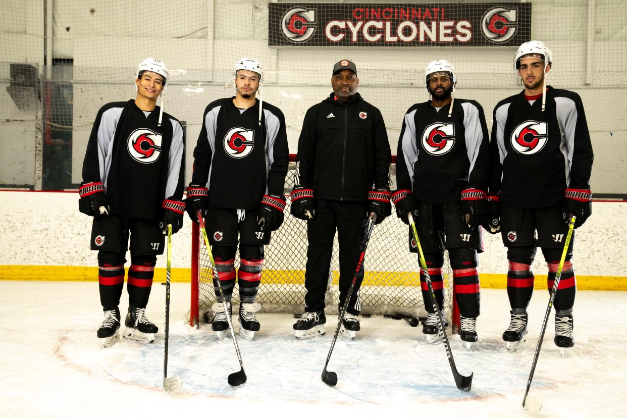 Cincinnati Cyclones players and coach, from left, Elijah Gonsalves, Kyle Bollers, Jason Payne, Josh Burnside and Landon Cato. The Cyclones made history March 30, becoming North America's first professional hockey team to start five Black players.
