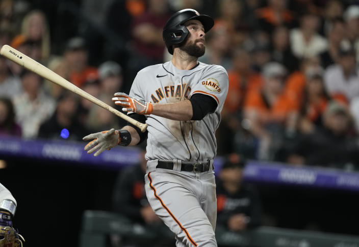 San Francisco Giants' Brandon Belt releases his bat after connecting for a solo home run off Colorado Rockies relief pitcher Ashton Goudeau in the sixth inning of a baseball game Friday, Sept. 24, 2021, in Denver. (AP Photo/David Zalubowski)