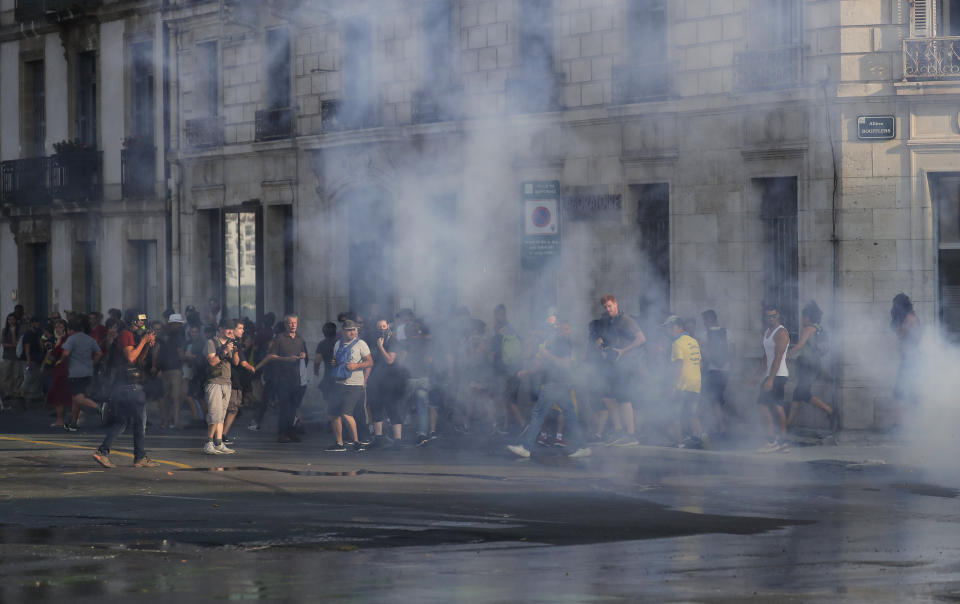 Police use teargas against protestors in Bayonne, France, Saturday, Aug. 24, 2019. World leaders and protesters are converging on the southern French resort town of Biarritz for the G-7 summit. Police have fired water cannon at about 400 anti-capitalist protesters blocking roads in a town near the venue of the G-7 summit. A few protesters threw rocks at police but the crowd in Bayonne was largely peaceful. (AP Photo/Emilio Morenatti)