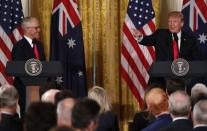 U.S. President Donald Trump (R) speaks as Australian Prime Minister Malcolm Turnbull looks on during a joint news conference at the White House in Washington, U.S., February 23, 2018. REUTERS/Jonathan Ernst