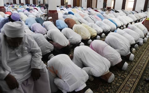 Amid fears of further attacks, authorities advised Muslims to pray at home on Friday, but many defied the warnings - Credit: AFP