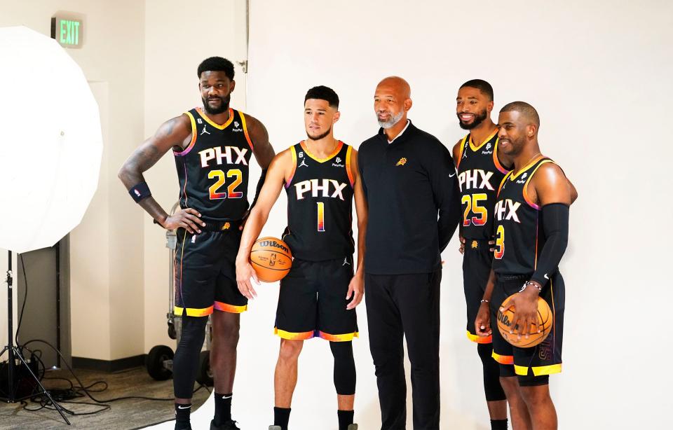 Phoenix Suns (L to R) Deandre Ayton, Devin Booker, head coach Monty Williams, Mikal Bridges, and Chris Paul pose for a team photograph at media day in Phoenix on Sept. 26, 2022.