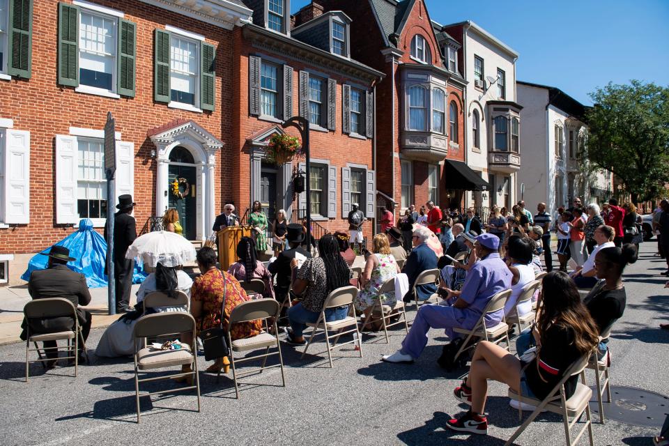 A crowd listens as York City Mayor Michael Helfrich speaks during a statue unveiling ceremony at the William C. Goodridge Freedom Center and Underground Railroad Museum on Friday, August 12, 2022, in York .