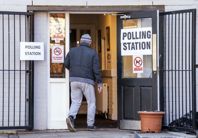 A man arrives at Sharon Youth Centre in Stretford to vote