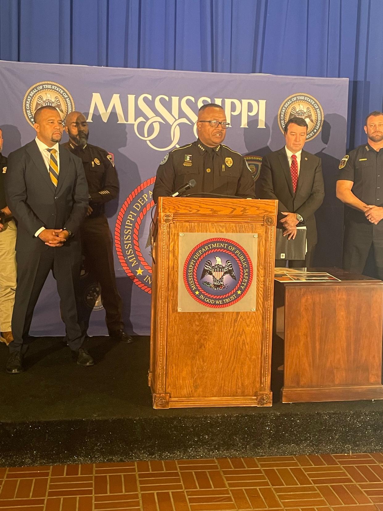 Jackson's Chief of Police Joseph Wade speaks alongside Hinds County District Attorney Jody Owens (left) and Commissioner of the Mississippi Public Department of Public Safety Sean Tindell (right) at a press conference discussing Operation Unified, which aims to reduce crime in Jackson.