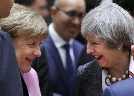 British Prime Minister Theresa May and German Chancellor Angela Merkel attend the EU summit in Brussels, Belgium, March 9, 2017. REUTERS/Yves Herman