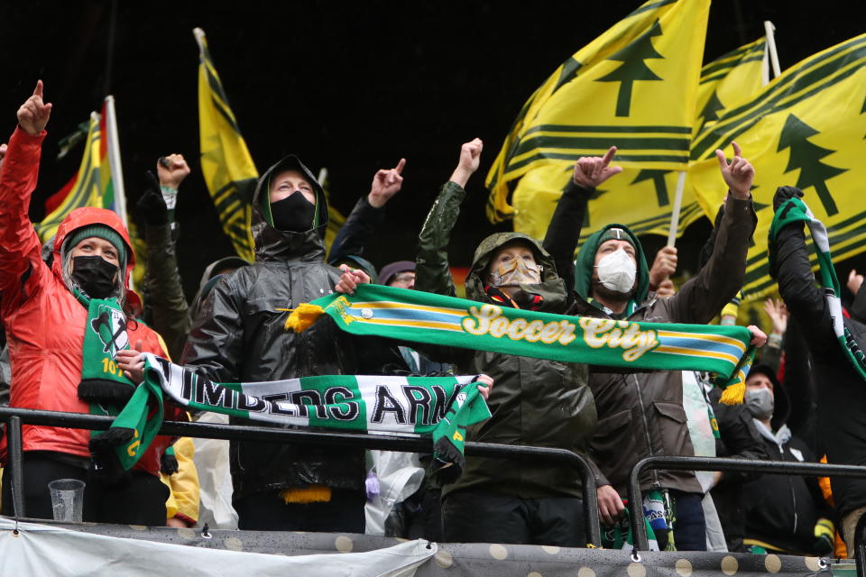Portland Timbers supporters cheer prior to the MLS Cup soccer match against New York City FC on Saturday, Dec. 11, 2021, in Portland, Ore. (AP Photo/Amanda Loman)