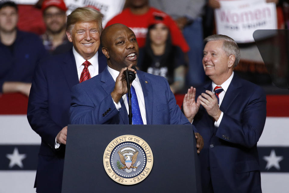 FILE - Sen. Tim Scott, R-S.C., speaks in front of President Donald Trump and Sen. Lindsey Graham, R-S.C., during a campaign rally, Friday, Feb. 28, 2020, in North Charleston, S.C. When Scott launched his campaign for the White House last week, the notoriously prickly former President Donald Trump welcomed his new competitor with open arms. “Good luck to Senator Tim Scott in entering the Republican Presidential Primary Race,” Trump said. (AP Photo/Patrick Semansky, File)