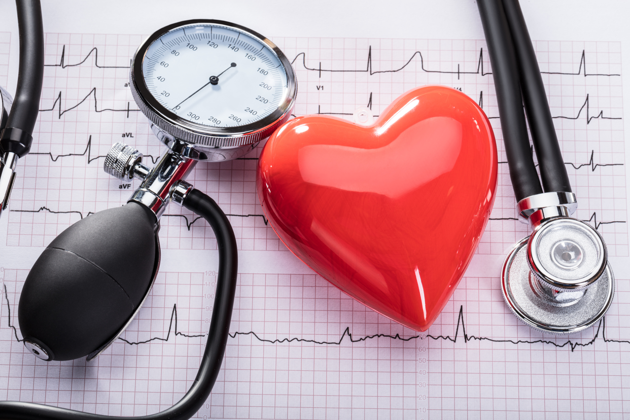 Doctor's equipment and a red heart signifying blood pressure