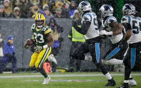 Green Bay Packers' Aaron Jones runs during the second half of an NFL football game against the Carolina Panthers Sunday, Nov. 10, 2019, in Green Bay, Wis - Credit: AP