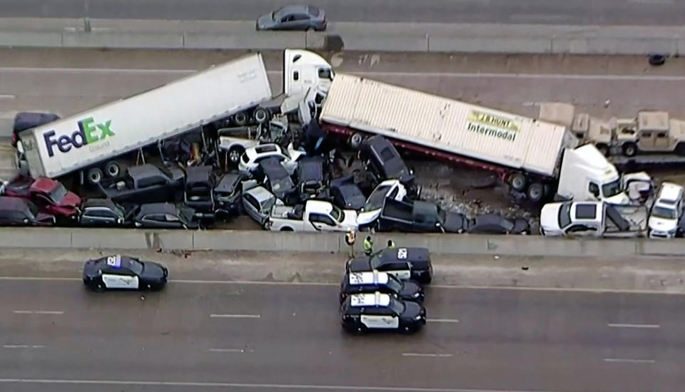 Image: Cars and trucks are wedged together after a morning crash on the ice covered I-35 in Fort Worth (NBC5 / Reuters)